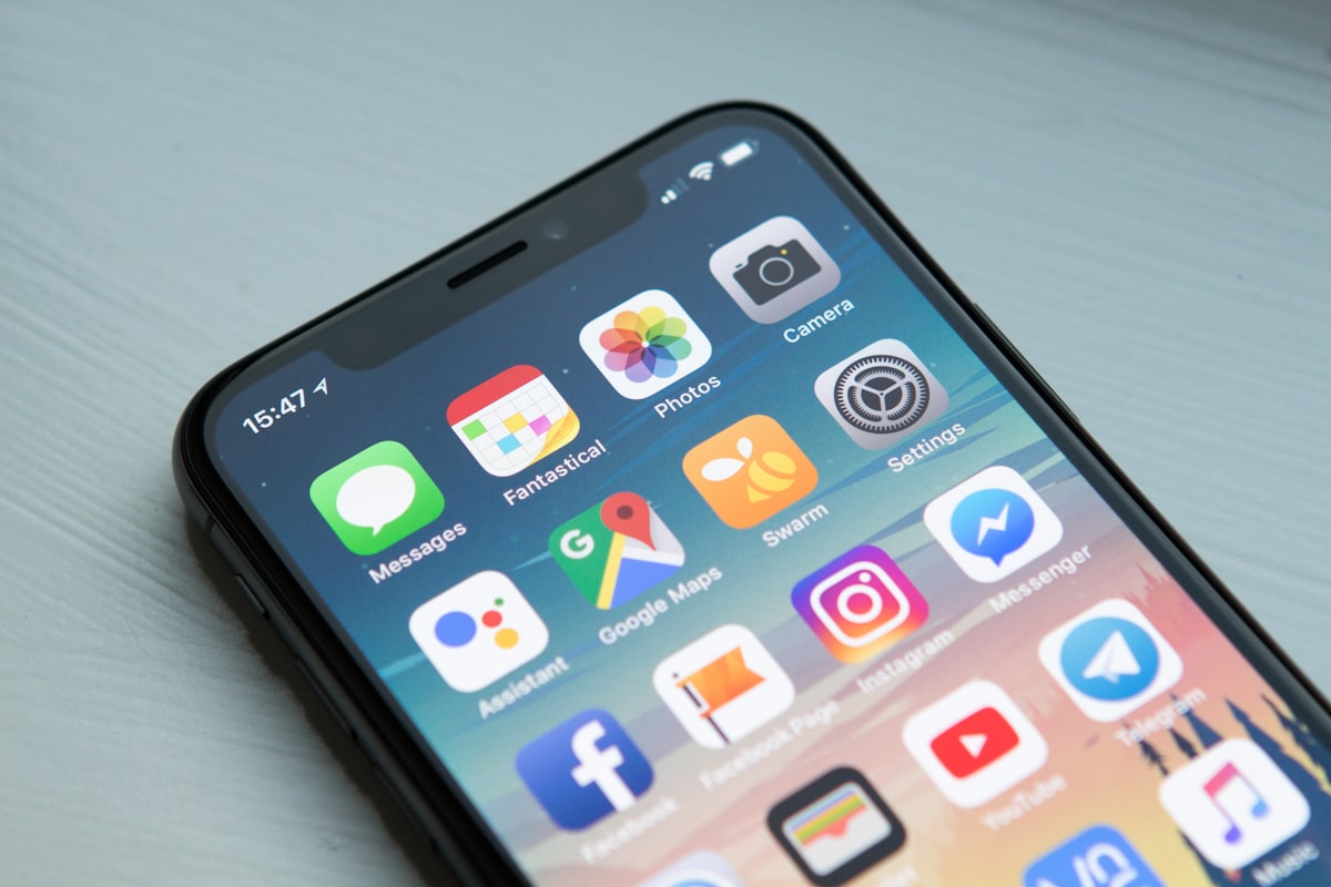 Person using AI mobile apps on a smartphone with futuristic interface