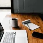Professional non-developer using AI tools on laptop for productivity in office environment 2026