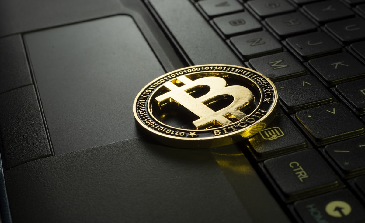 Cryptocurrency coins and smartphone showing successful faucet payment notification