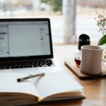 Digital nomad working remotely on laptop from a scenic location representing location-independent career
