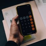 Professional working in finance career without degree earning high salary with charts and financial data