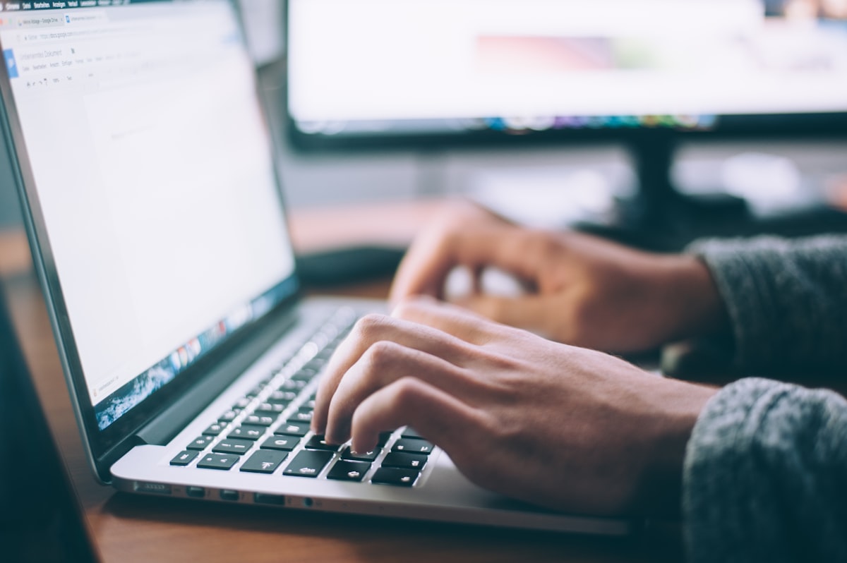 Professional working remotely from home office with laptop earning high salary flexible job