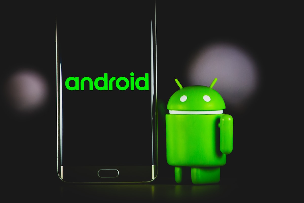 Smartphone screen showing mobile app code with AI prompts and development environment