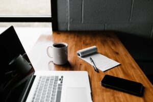 Affiliate marketer working on laptop with digital products and commission earnings on Digistore24