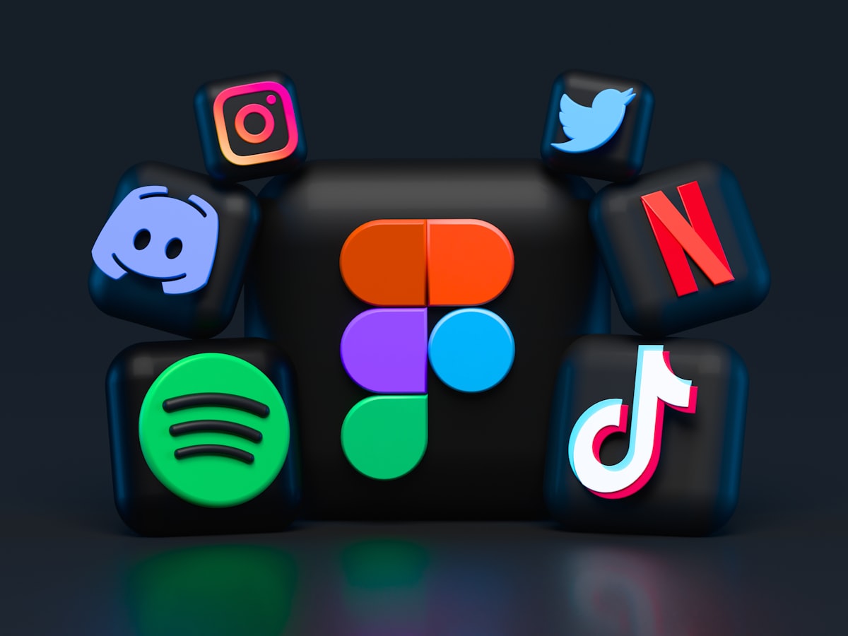 Person scrolling through social media on a smartphone with colorful app icons